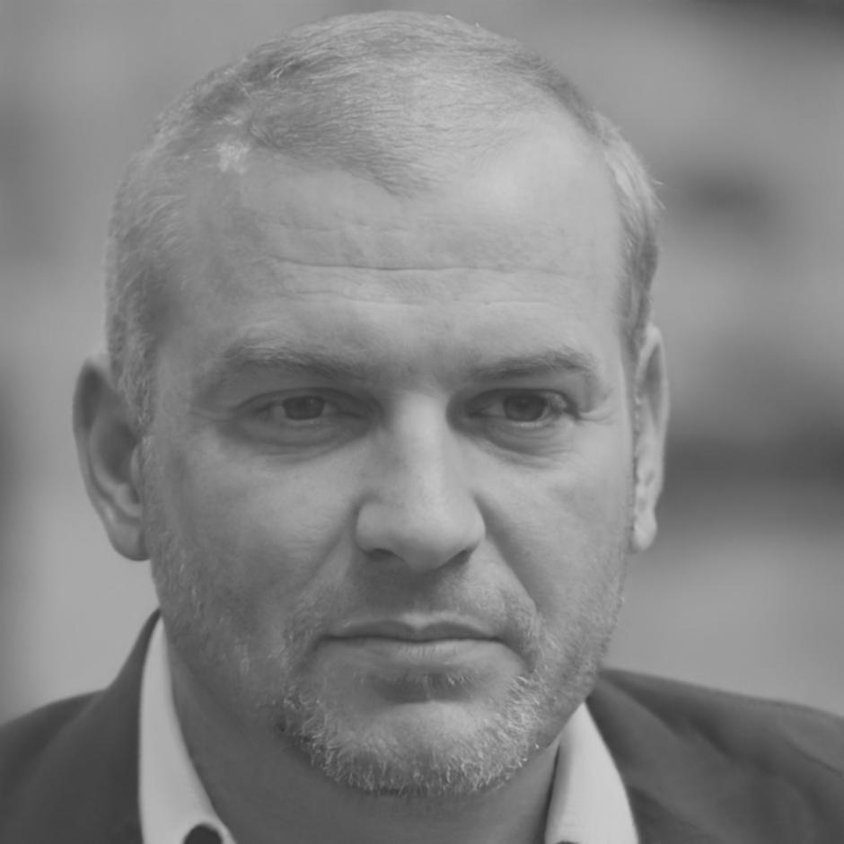 Professional headshot of team member