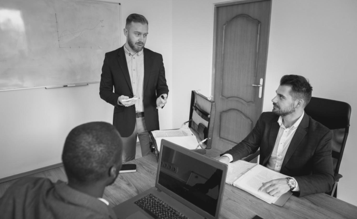 Team collaboration session focusing on fraud prevention strategies and client education